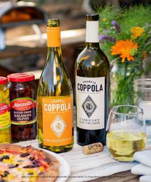 Coppola wines with a glass, a freshly baked pizza and condiments