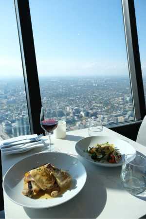 Chicken Coq au Vin, salad and a glass of wine at 360 Restaurant inside the CN Tower