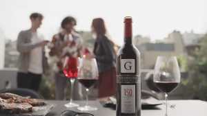 Graffigna | A bottle of Graffigna and wine glasses at a party