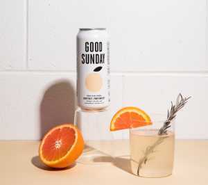 Summer drinks | A can of Good Sunday with glasses and orange wedges