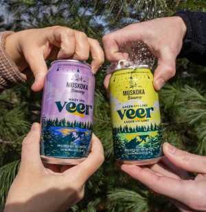 Summer drinks | Two people opening cans of Veer non-alcoholic beer
