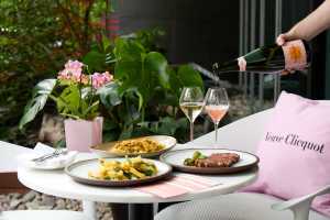 The best patios in Toronto | A spread of food and Veuve Cliquot at bosk inside the Shangri-la