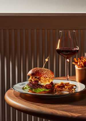 Frenchy Toronto | The hamburger and a glass of red wine at Frenchy Toronto