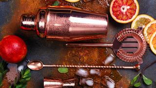 Cocktail recipes and tips from Toronto's best bartenders | A rose gold shaker, strainer and stir spoon surrounded by fruit