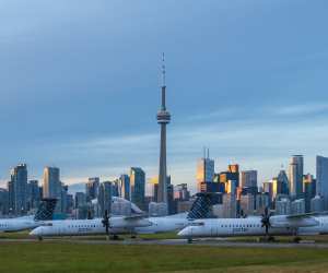 Billy Bishop Toronto City Airport in front of the Toronto skyline at dusk