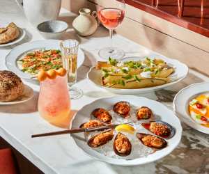 New culinary experiences in Toronto | A spread of dishes at Toronto Beach Club