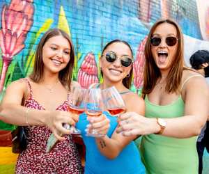 Three people enjoying glasses of wine at Wine Fest Toronto