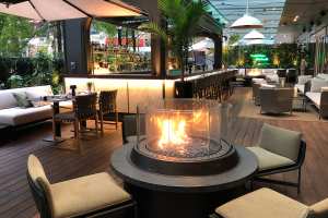 Best patios in Toronto | A fire pit on the patio at EPOCH Bar & Kitchen Terrace