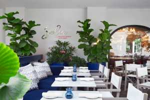 Restaurants with art | Blue velvet seating at Sofia