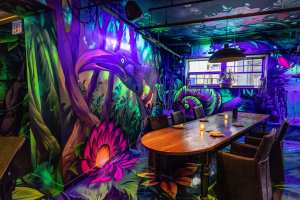 Restaurants with art | A mural depicts tropical birds inside Selva