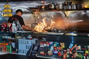 Superfresh Asian night market | Chef cooks over flames at Jajan inside Superfresh