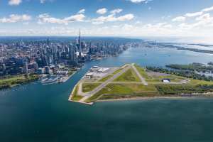 An overhead shot of Billy Bishop Toronto City Airport and the Toronto skyline