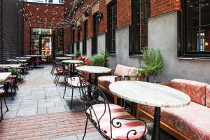 Best patios in Toronto | Bistro tables and chairs on Lapinou's alleyway patio