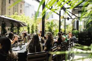 Best patios in Toronto | People sitting at the bar on Chotto Matte's patio