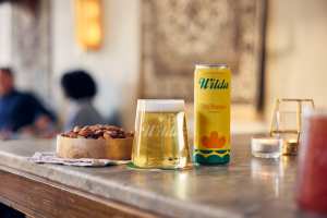 Summer drinks | Wilda Dry Hopped on the bar counter with a glass Summer drinks | Wilda Dry Hopped on the bar counter with a glass