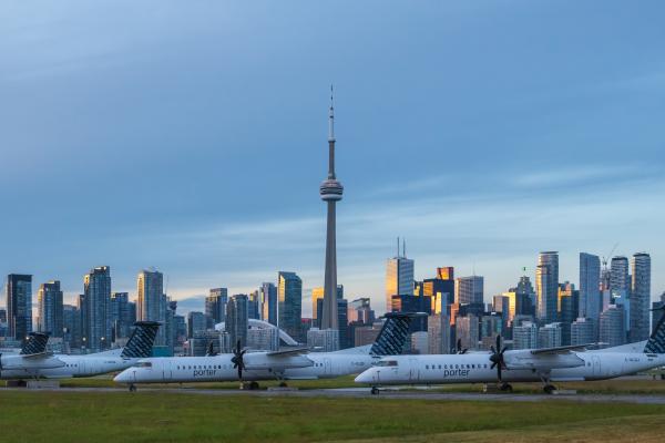 Airplanes at Billy Bishop Toronto City Airport in front of the Toronto skyline