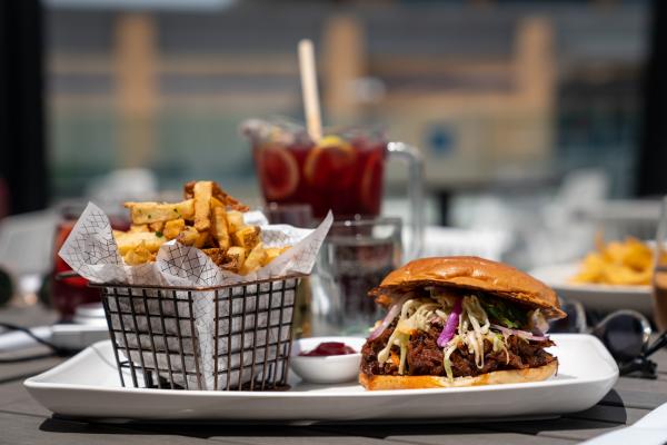 Best patios in Toronto | A burger and fries at The Rec Room on the patio