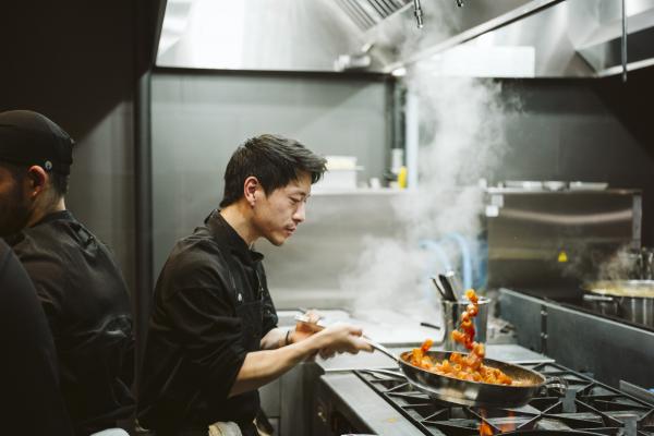 Best restaurants Toronto | A chef flips a pan of pasta at DaNico