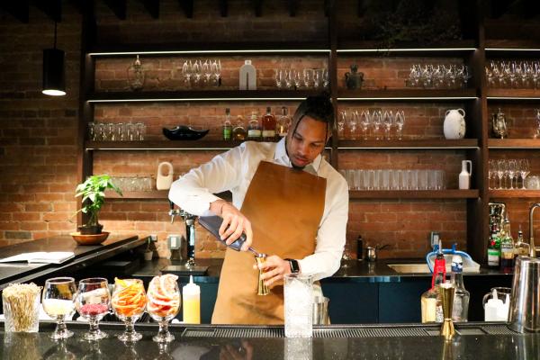Best new restaurants in Toronto | A bartender making cocktails at Azura