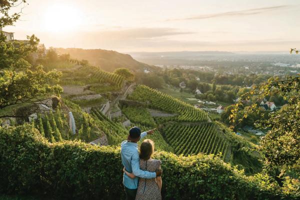 Saxony, Germany | A couple overlooks vineyards in Radebeul