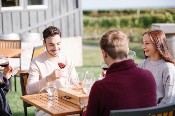 Best wineries in Beamsville | A table of guests at Thirty Bench Winemakers