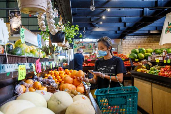 A woman shopping at St. Lawrence Market in Toronto