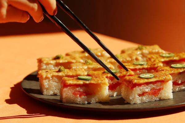 Summerlicious Toronto | Chopsticks reach for a platter of salmon oshi at Minami Toronto
