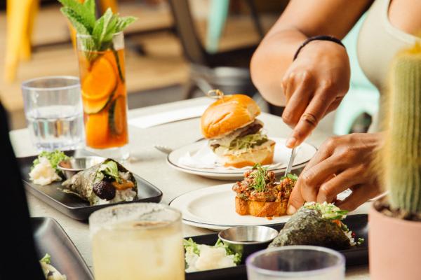 Someone cuts into steak tartare at the Drake Cafe