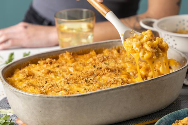 A spoonful of a creamy mac and cheesy bake