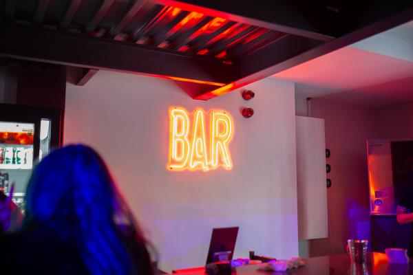 Durham Region day trips | A neon bar sign inside BOND|ST Snack Bar in Oshawa