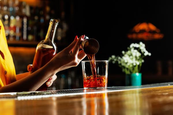 Best bars in Toronto | A bartender garnishes a cocktail at The Cloak Bar