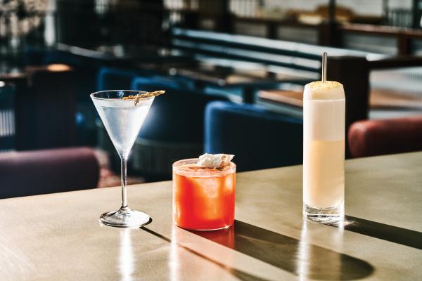 Three cocktails on the bar at Civil Works in Toronto