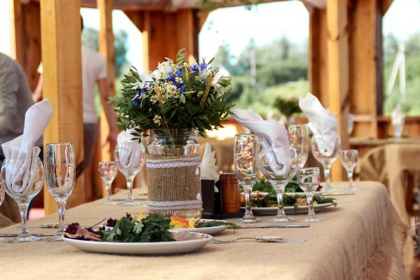 A decorated table with plates and flowers