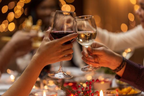 People cheers with glasses of wine