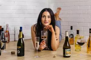 Canadian wine | Wine expert Lauren Power surrounded by wine bottles