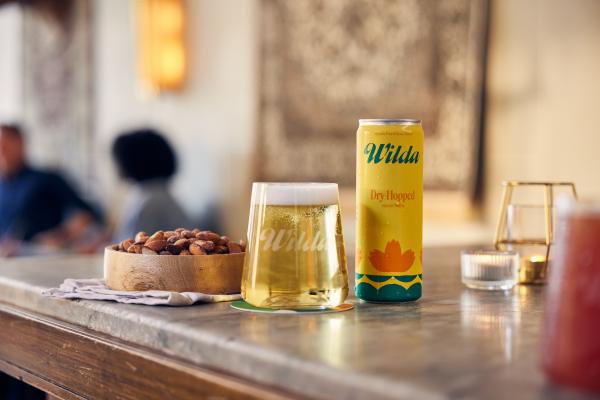 Summer drinks | Wilda Dry Hopped on the bar counter with a glass Summer drinks | Wilda Dry Hopped on the bar counter with a glass