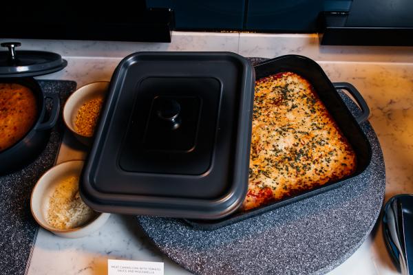 A dish of hot food inside the Aspire | Air Canada Café at Billy Bishop Toronto City Airport