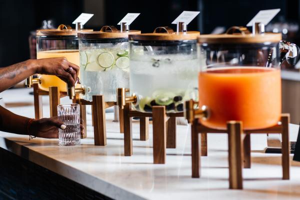 Drink options in dispensers inside the Aspire | Air Canada Café at Billy Bishop Toronto City Airport