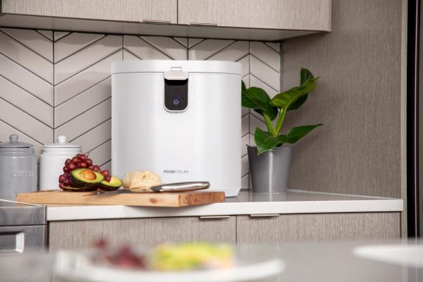 The FoodCycler by Vitamix Eco 5 on a counter with food scraps