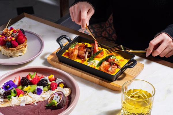 Best new Toronto restaurants | Digging into a lobster dish at Glass Kitchen