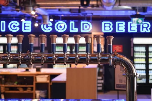 Left Field Brewery, Liberty Village, Toronto | Taps and an "Ice cold beer" sign inside Left Field Brewery Left Field Brewery, Liberty Village, Toronto | Taps and an "Ice cold beer" sign inside Left Field Brewery