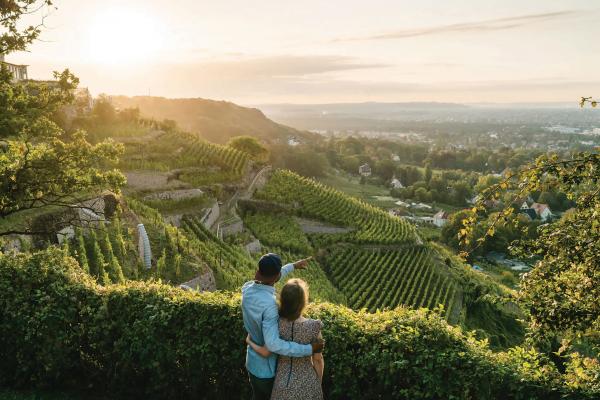 Saxony, Germany | A couple overlooks vineyards in Radebeul Saxony, Germany | A couple overlooks vineyards in Radebeul