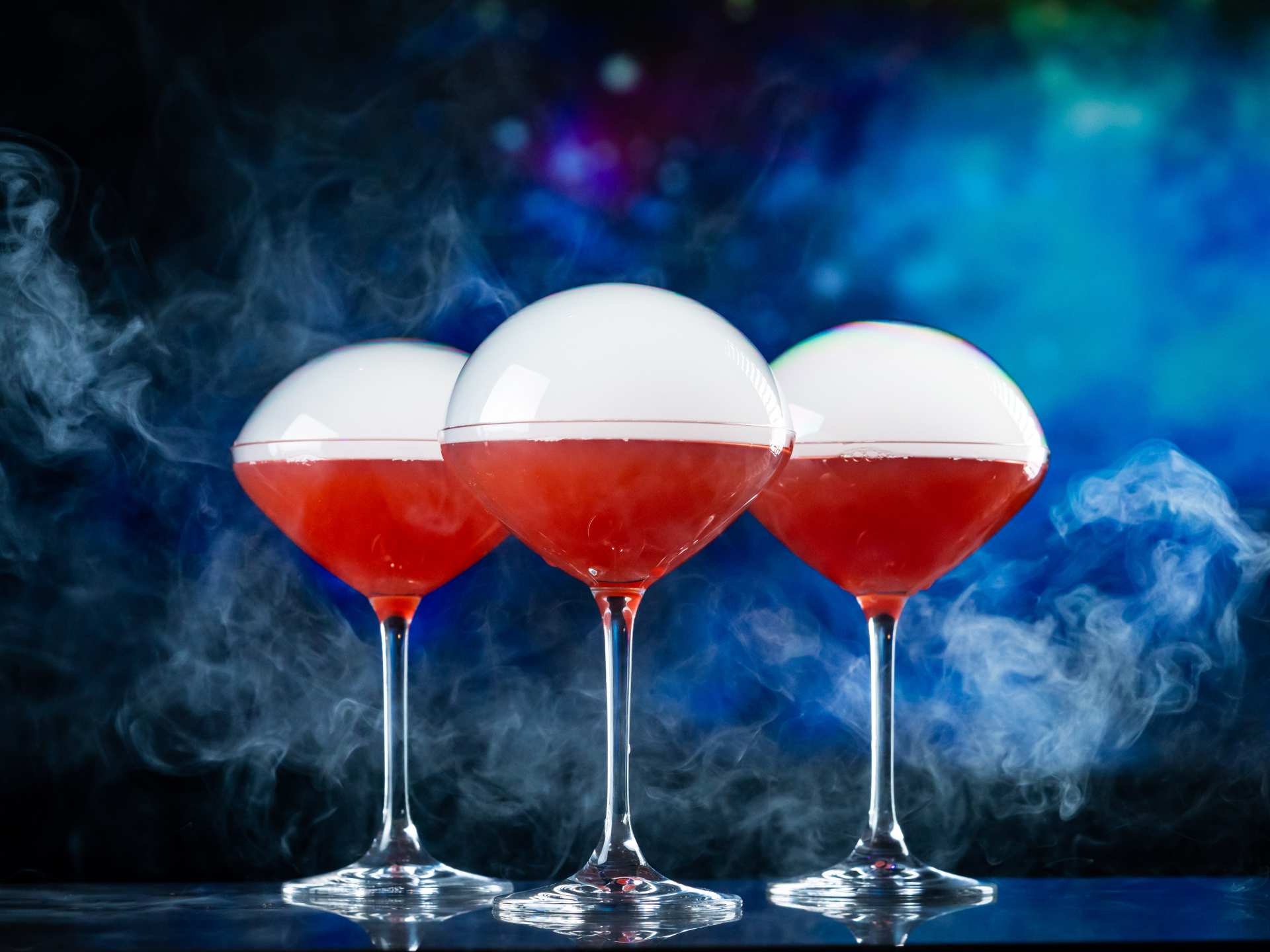 Offworld | Three red cocktails with bubbles