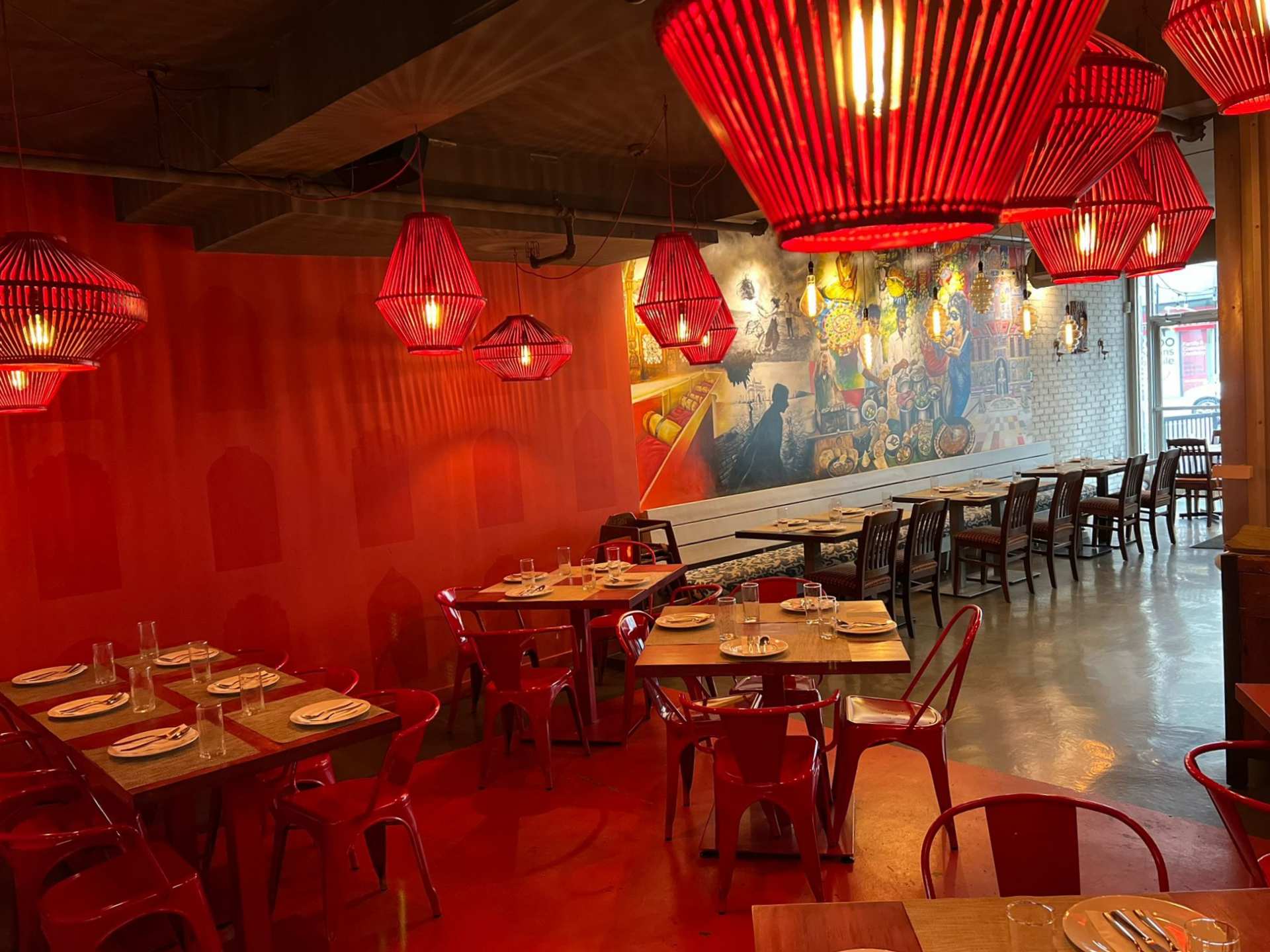 Khau Gully vegan menu | The red dining room with tables and chairs at Khau Gully