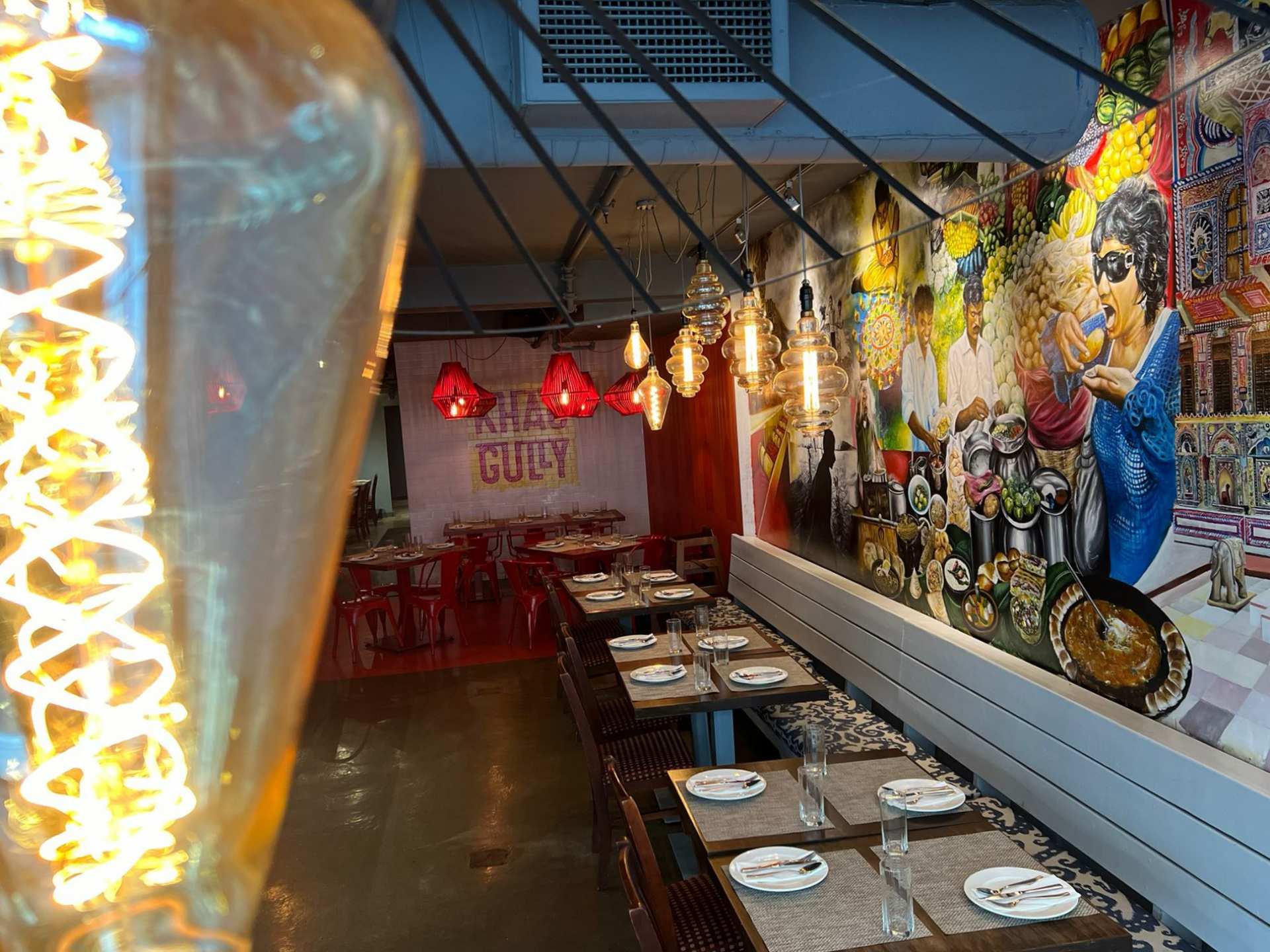 Khau Gully vegan menu | The dining room with an art mural at Khau Gully restaurant