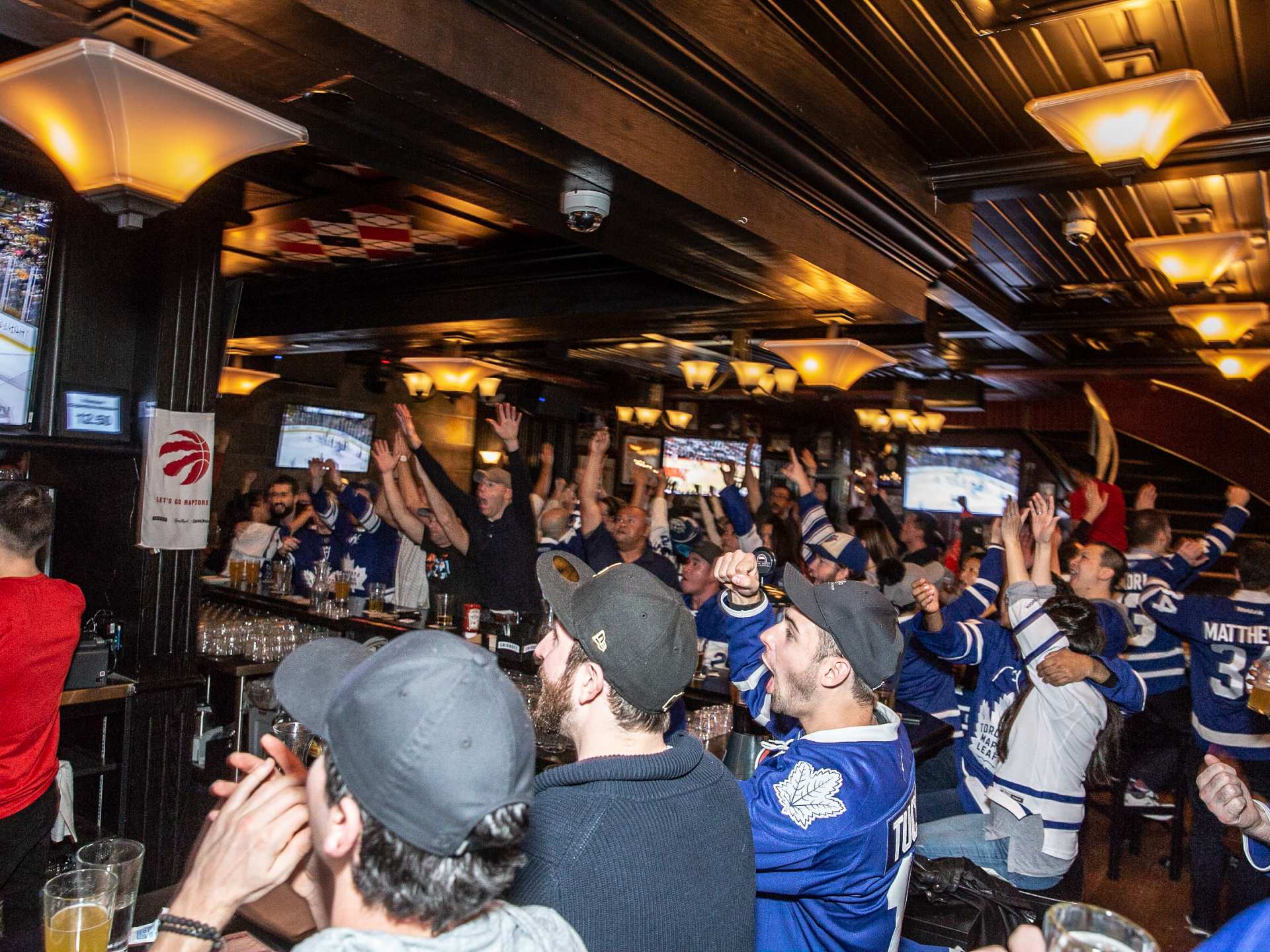 Best sports bars Toronto | Celebrating at Leafs win at The Pint