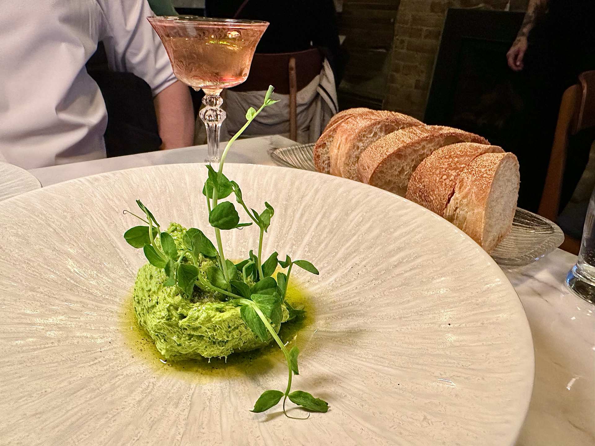 Spring onion and pea shoot butter with bread at The Hamptons restaurant in Toronto