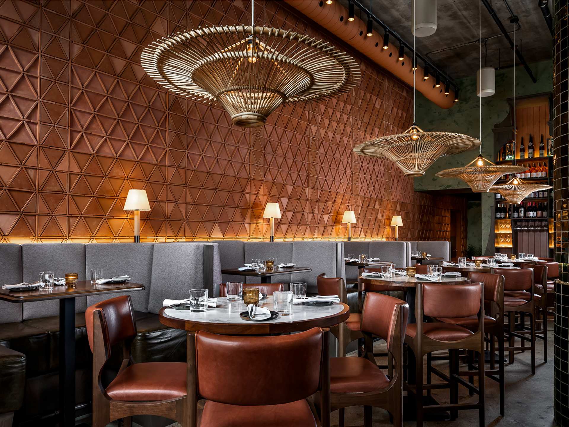 Late night food in Toronto | The dining room at Bar Chica with tables and light fixtures
