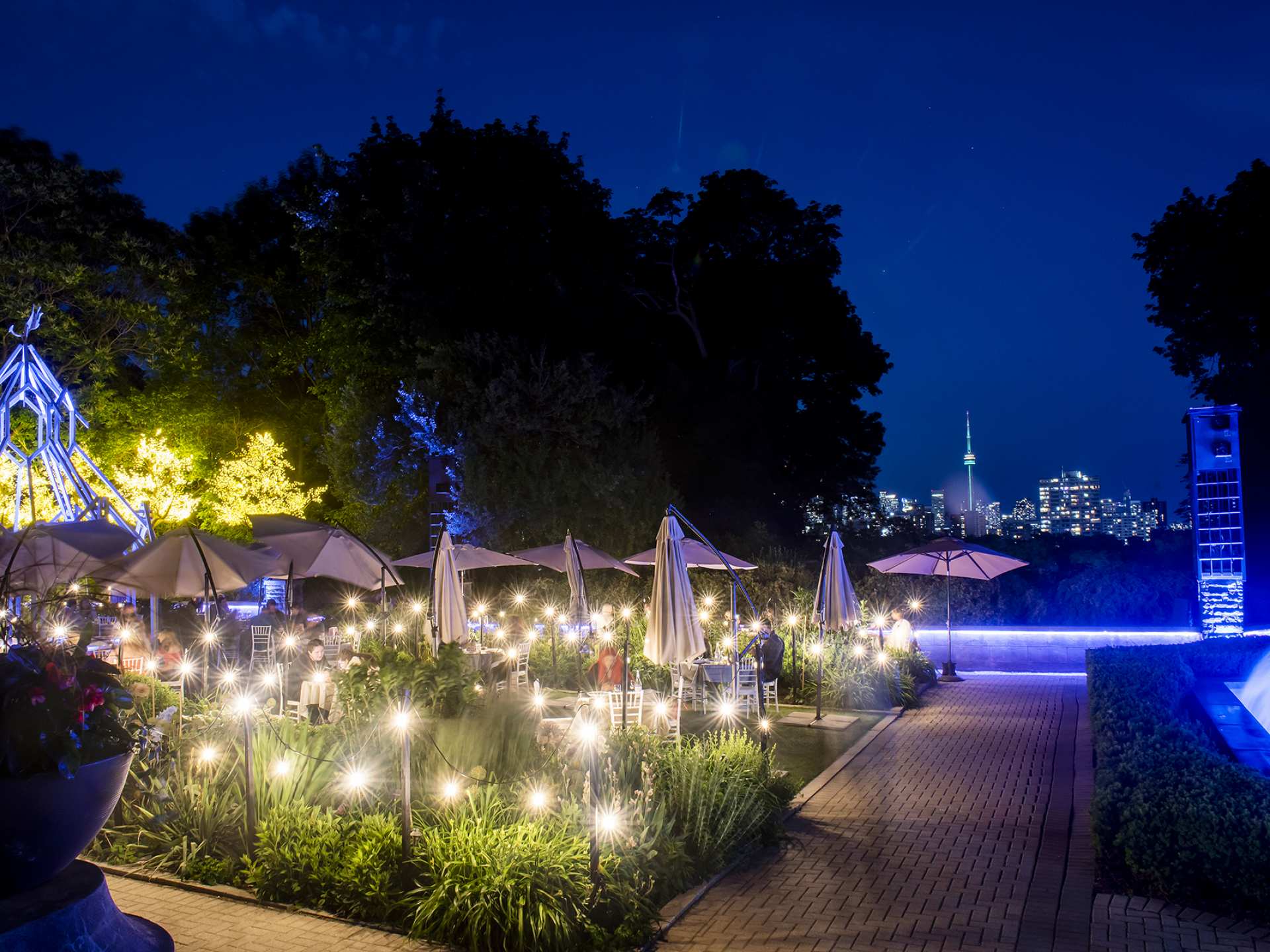 Best patios in Toronto | A view of Toronto from The Gardens at Casa Loma at night