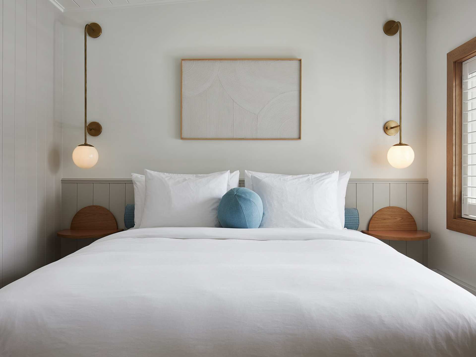A bed inside a guest room at The Beach Motel, Southampton, Ontario